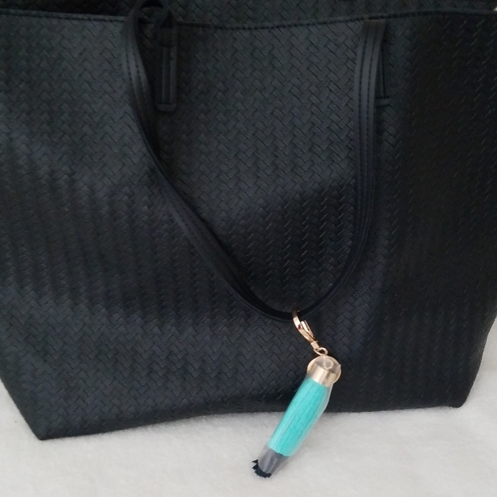 Black vinyl tote bag with zipper closure